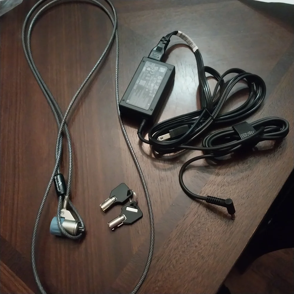 Brand New HP Laptop Charger With Targus Black Laptop Bag And Desk Lock.
